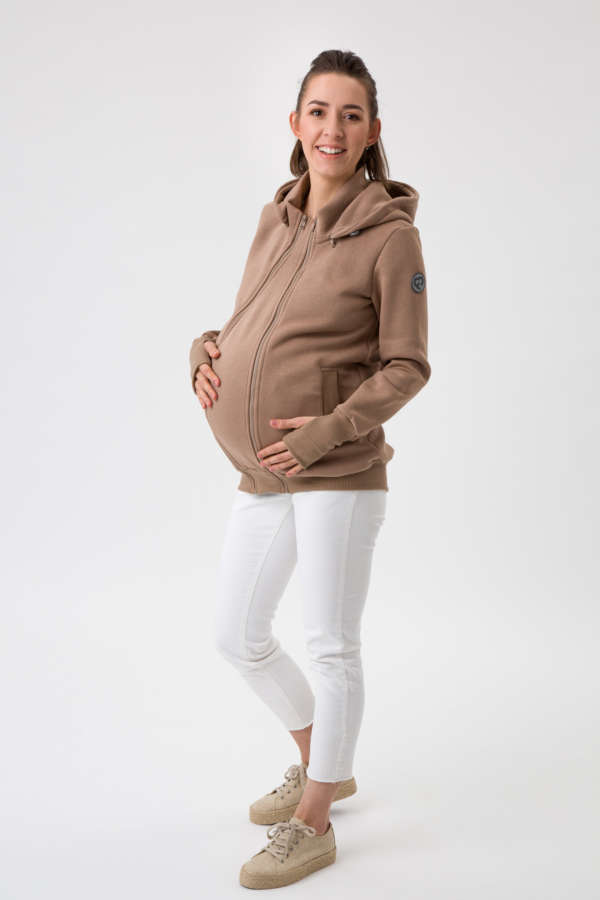 Une jaquette de portage pour porter votre enfant au chaud en toute saison. Avec son insert portage et de grossesse, c'est une veste 5 en 1 qui vous accompagnera de la grossesse à la marche. Pour porter au dos et en ventral. Achat en suisse. Venez tester et essayer en boutique
